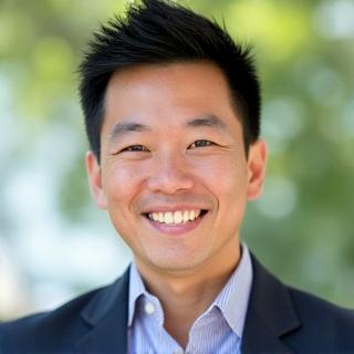 Professional headshot of Marcus Chen, Head of Wellness Programs.